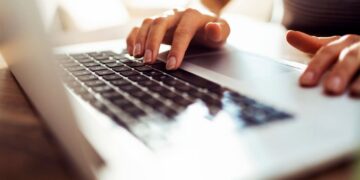 Close up of a young woman working from home