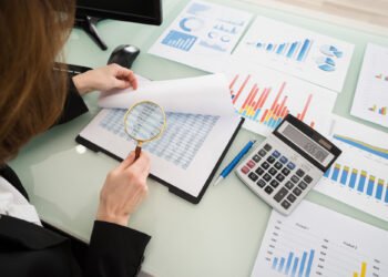 Businesswoman Looking At Financial Report