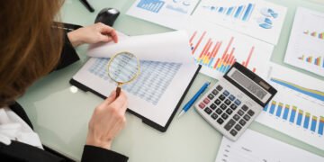 Businesswoman Looking At Financial Report