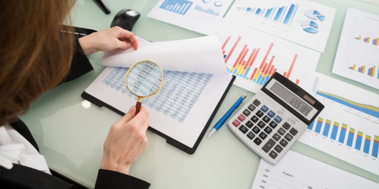 Businesswoman Looking At Financial Report